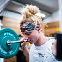 Load image into Gallery viewer, The photo shows a girl weightlifting in a white Proudly Refusing To Obey Authority Vest Top.  The words just mentioned are positioned on the left breast with The Defiant Co logo underneath.
