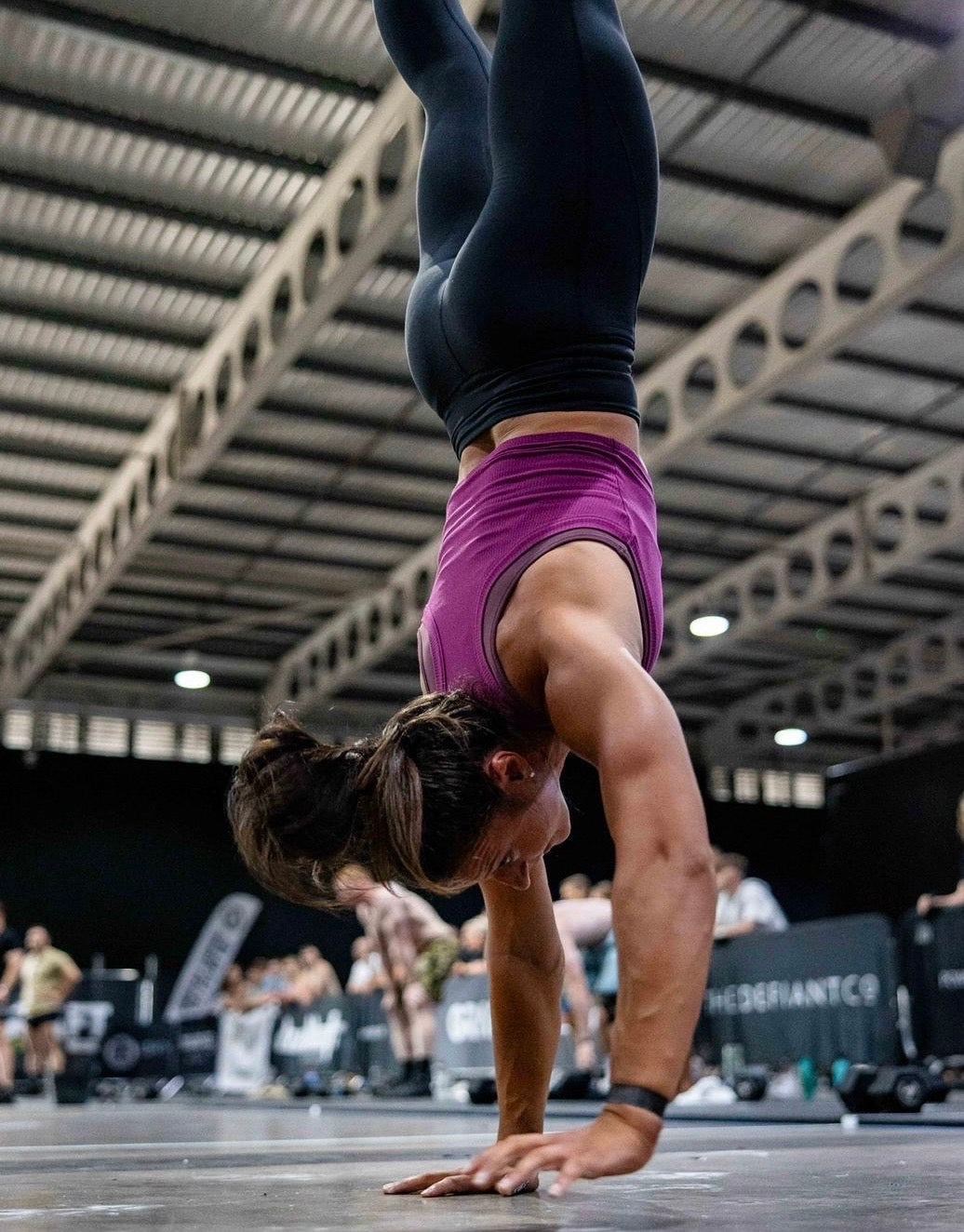 A great shot of a girl doing a handstand walk in our amazing ribbed cropped tank in the colour orchid flower. The tank is slightly cropped to give breathability during workouts.  The material is ribbed throughout and is extremely soft to touch.
