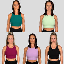 Load image into Gallery viewer, A photo collage of two girls wearing the 5 colours available in the DFNT. ribbed cropped tank - Black, Orchid Flower, Lime, Teal &amp; Lilac.  The tanks have a high neck and are naturally breathable.  The fabric is soft to the touch and stretchy. The logo placement is via a tag sewn into the left seam.