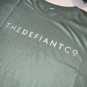 A photo showing a female fit cropped t-shirt. The shirt has the famous ‘The Defiant Co’ logo across the front of the chest.  The shirt has standard sleeves and a round neck.  The shirt is sage green in colour.