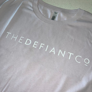 A photo showing a female fit cropped t-shirt. The shirt has the famous ‘The Defiant Co’ logo across the front of the chest.  The shirt has standard sleeves and a round neck.  The shirt is light orchid in colour.
