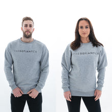 Load image into Gallery viewer, A high-quality Crewneck Sweatshirt for use in the gym and beyond! Crewnecks are absolutely indispensable basics – and this Sweatshirt is a firm favourite for its soft wearing comfort. The crewneck is a standard unisex fit and has the Famous The Defiant Co logo embossed across the chest. The colour is heather grey.