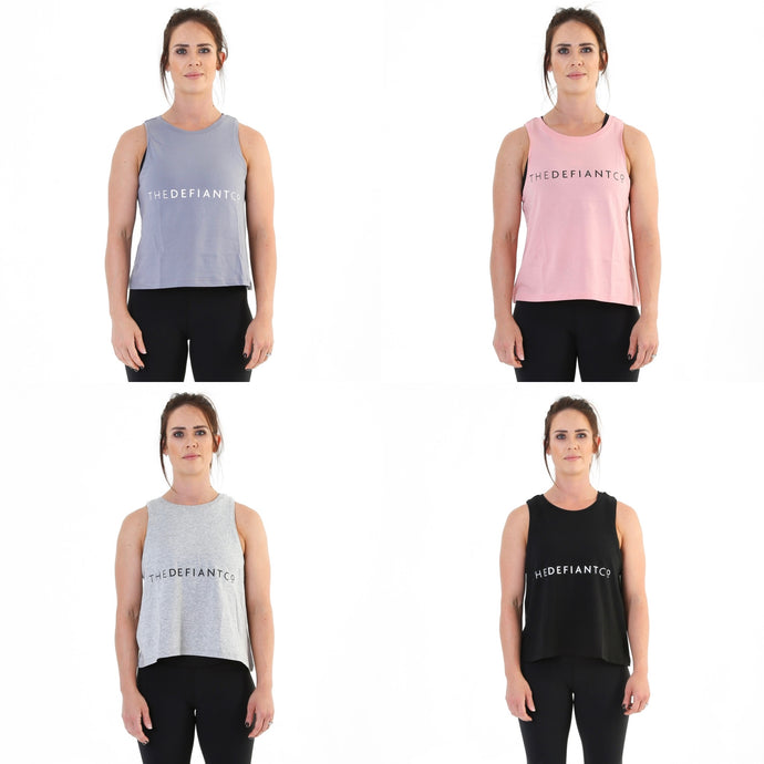 A photo collage showing a girl wearing The Defiant Co vest tops that are currently in the sale.  The 4 options are lava grey, canyon pink, heather grey and black.  The vests have a high neck and floaty feel due to their slightly oversized fit, they are slightly cropped. The back is plain and chest proudly displays The Defiant Co logo.