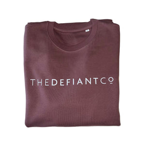 A high-quality Crewneck Sweatshirt for use in the gym and beyond! Crewnecks are absolutely indispensable basics – and this Sweatshirt is a firm favourite for its soft wearing comfort. The crewneck is a standard unisex fit and has the Famous The Defiant Co logo embossed across the chest. The colour is dusty burgundy.