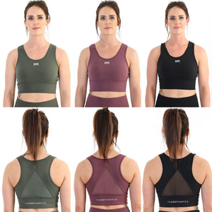 A collage showing the front and back of the amazing DFNT. Performance Sports Bra.  The bras come in dark olive, burgundy and black respectively.  The logos on them are all white and screen printed, DFNT. small and subtle on the front and The Defiant Co on the band across the back.  The bras have a reasoanbly high neckline to ensure durability in workouts and have a mesh back to enable ensure breathability.