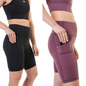 A side on view of the cycling style shorts offered by The Defiant Co.  This photo that shows the shorts in black and burgundy is demonstrating the use of the pocket that is on the right leg.