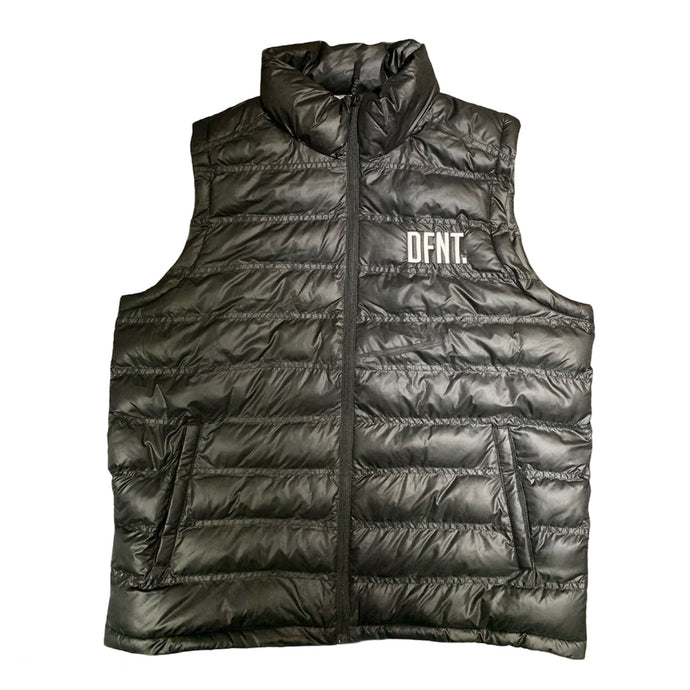 A stunning puffer gilet in black.  The gilet has a zip that runs all the way down the middle of the garment.  There are two zip pockets to keep all your belongings.  The DFNT. logo is embroidered in white on the left breast.